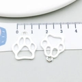 Silver animal paw print charm in hollow metal design for DIY jewelry and crafts - Bright Silver Large Paw (20654)