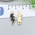 Colorful enamel lightning bolt pendant with golden finish and back texture detail - Black (12445)