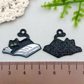 Cute black cat on white book enamel alloy pendant with yellow eyes and textured back - 27*20mm / Black Cat Lying on Book