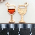 Detail of wine glass charms in gold alloy with orange enamel and back texture - Red Enamel Wine Glass