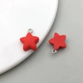 Two red matte resin star charms with silver rings for DIY jewelry making and crafts - Red