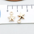 Golden star pendant with bail for DIY jewelry making, measuring approximately 12mm - KC Gold Star (18240)