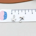 Macro detail of a 10mm silver alloy star pendant with 3D design and integrated loop - Antique Silver Small Star (5082)