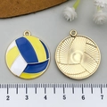 Detailed close-up of blue and yellow enamel volleyball charms with golden metal back - Enamel Volleyball Style (19028) / Blue-Yellow