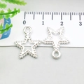 Macro shot of silver alloy star pendants with 1.3cm scale for DIY jewelry making - Bright Silver Pentagram (20835)