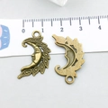 Detailed close-up of antique bronze crescent moon charms with intricate beaded texture - Antique Bronze Moon (2431)