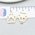 Golden cat paw hollow alloy charm for DIY jewelry making, shown with measuring scale - Hollow Cat Paw Style (20626)