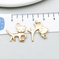 Gold cat playing with ball alloy charms for DIY jewelry measuring 2.2cm in length - Cat Playing With Ball Style (20627)
