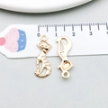 Golden cat-shaped metal alloy charm with detailed front and smooth back view on scale - Striped Texture Sitting Cat Style (20631)