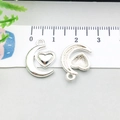 Silver crescent moon with heart pendant for DIY jewelry making shown with ruler for size - Bright Silver Heart Moon (20841)