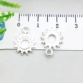 Silver alloy sunburst charm pendant with radiant rays design and top hanging loop - Bright Silver Sun (20854)