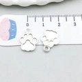 Close-up of small silver cat paw pendants with textured finish and measurement scale - Bright Silver Striped Cat Claw (20636)