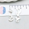Silver alloy cat charms for DIY jewelry making shown against a scale for size reference - Bright Silver Horizontal Stripe Cat (20644)