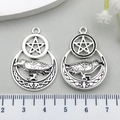 Antique silver moon and raven star pendant shown with a ruler for size reference - Pentagram Raven Moon (18732)