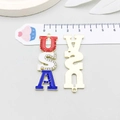 Detail of USA letter pendant with enamel finish and size measurement on scale - Enamel USA Letters Style (19072)