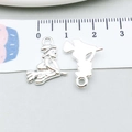 Macro view of 2cm silver alloy charms featuring witch on broom and mermaid silhouette - Witch Style (20115) / 14x17mm