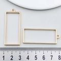 Golden rectangular alloy frame pendant for DIY jewelry making shown with measurement ruler - Rectangular Frame