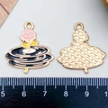 Detail view of pink enamel phonograph charm with rose design and gold metal back - Pink Enamel Rose Record Style (21776)