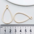 Golden teardrop alloy charms set, size 35x22mm shown with scale measurement - Water Drop Frame