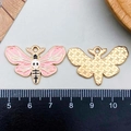 Pink enamel skeleton butterfly charm in gold finish showing front and back view - Pink Enamel Butterfly Style (21779)