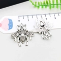 Antique silver bee charms showing front and back texture with measurement scale - 24*26mm / Antique Silver Bee Style (7226)