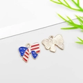 Enameled American flag butterfly pendant with gold-plated textured backing and hanging loop - Bow Shape (16273)