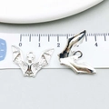 Silver alloy bat charms for DIY jewelry making shown with a measuring tape - Bat Style (20127)