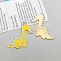 Detail showing front and back of cartoon dinosaur enamel pendant with floral patterns - Yellow Floral Dinosaur Style (18106) / 1 Piece/Pack (33x32mm) / Yellow