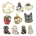 Set of 10 enamel cat charms in black and white with gold alloy edges for DIY jewelry making - Mixed Styles (SN556)