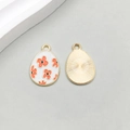 White enamel Easter egg pendant with orange flowers and golden plating detail - Red Flower Style