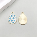 White enamel Easter egg charm with blue dots and gold finish for DIY jewelry - Blue Polka Dot Wave Style
