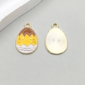 Colorful Easter egg enamel pendant featuring a yellow chick and golden metal texture - Eggshell Chick Face Style