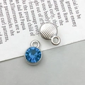 Silver-plated round pendant with faceted deep blue starstone and striped back detail - Silver March Style (13495)