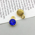 Antique gold alloy round pendant with faceted dark blue stone and vertical stripe texture - September-Dark Blue