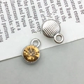 Silver alloy pendant with faceted amber stone and vertical striped metal back - Silver November Style (13503)
