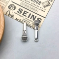 Vintage silver alloy microphone pendant with detailed mesh and circular hanging loop - Antique Silver Microphone Style