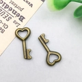 Pair of vintage bronze alloy heart-shaped key pendants for DIY jewelry making - 8x15mm / Heart Vintage Mini Key Style (912)