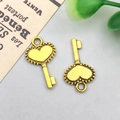 Antique gold heart-shaped key pendant for DIY jewelry making with embossed details - 19x9mm / Antique Gold Heart Vintage Key Style (11091)
