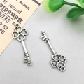 Vintage silver alloy skeleton key pendant with lucky four-leaf clover hollow design - 8x25mm / Antique Silver Vintage Key Style (11245)