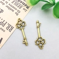 Set of two vintage gold alloy clover key pendants for DIY jewelry crafting and design - 25x9mm / Antique Gold Vintage Key Style (11369)