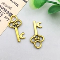 Antique gold alloy vintage key pendant with floral crown detail for DIY jewelry making - 15x10mm / Antique Gold Vintage Key Style (11374)