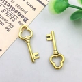 Pair of vintage style golden alloy key pendants with clover handles for jewelry making - 22x9mm / Antique Gold Vintage Key Style (11375)