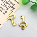 Pair of vintage-style golden alloy key pendants for DIY jewelry making accessories - 16x9mm / Antique Gold Vintage Key Style (11376)