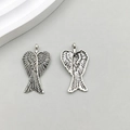 Pair of antique silver hollow angel wing pendants with detailed feather texture - Antique Silver Wing Style (2521)