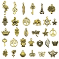 Collection of 30 vintage antique gold alloy charms including butterfly and tree leaf shapes - Mixed 30 Styles (SN37)