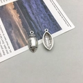Pendentifs football américain en alliage argenté vintage pour création de bijoux - Breloque Football Surpiquée Argent Antique