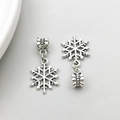 Detailed macro view of silver alloy snowflake charms with engraved large hole bail beads - Snowflake Shape (11473)