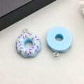 Detail of light blue resin donut pendants with colorful sprinkles and silver metal rings - Blue (17183)