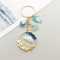 Llavero océano azul con colgantes de delfín pulpo y concha en acabado dorado - Estilo Concha Delfín Pulpo Esmalte Azul