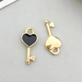 Pair of heart-shaped key alloy pendants in gold finish with black enamel drip oil - Black Enamel Heart Key Style (11042)